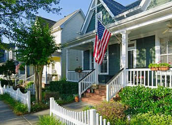 Front porch of a home that has an American flag displayed